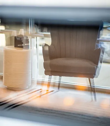 A waiting-room armchair beside the window.